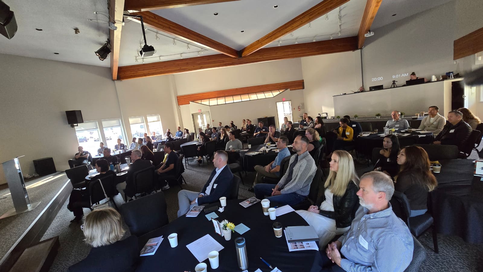 The 2025 room at Hillside Church: business owners at round tables during the morning session